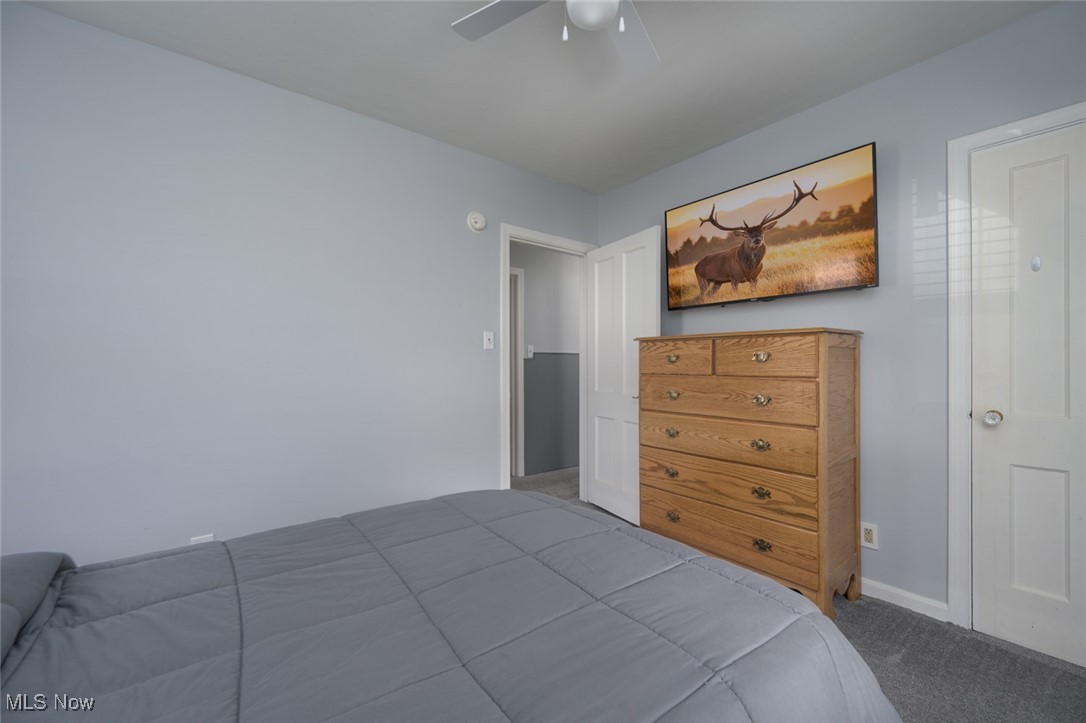 2547 Mogadore Road Akron, OH 44312 - Photo 16 of 31 Bedroom featuring carpet flooring and ceiling fan