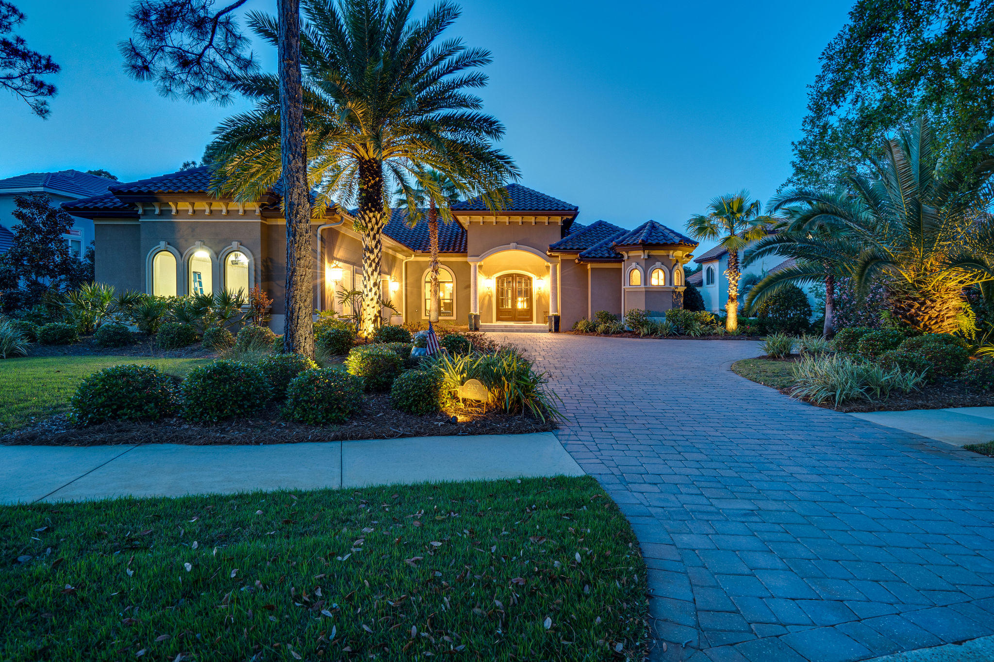 2957 Pine Valley Road Miramar Beach, FL 32550 - Photo 3 of 15 a front view of a house with a garden and yard