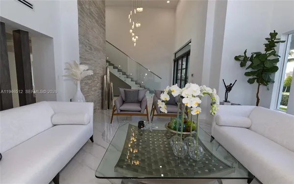 a dining room with a table and chairs