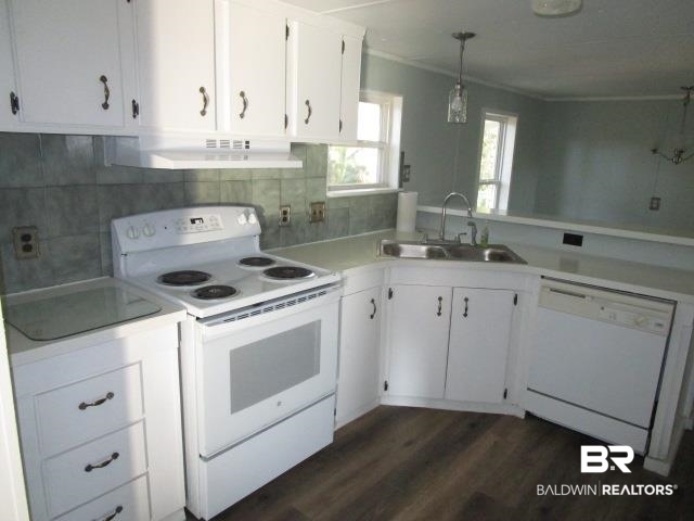 14791 Raber Road Summerdale, AL 36580 - Photo 8 of 21 Kitchen featuring dark hardwood / wood-style flooring, white appliances, sink, pendant lighting, and white cabinets