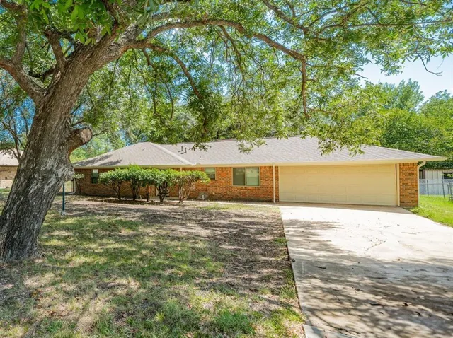a house with trees in front of it