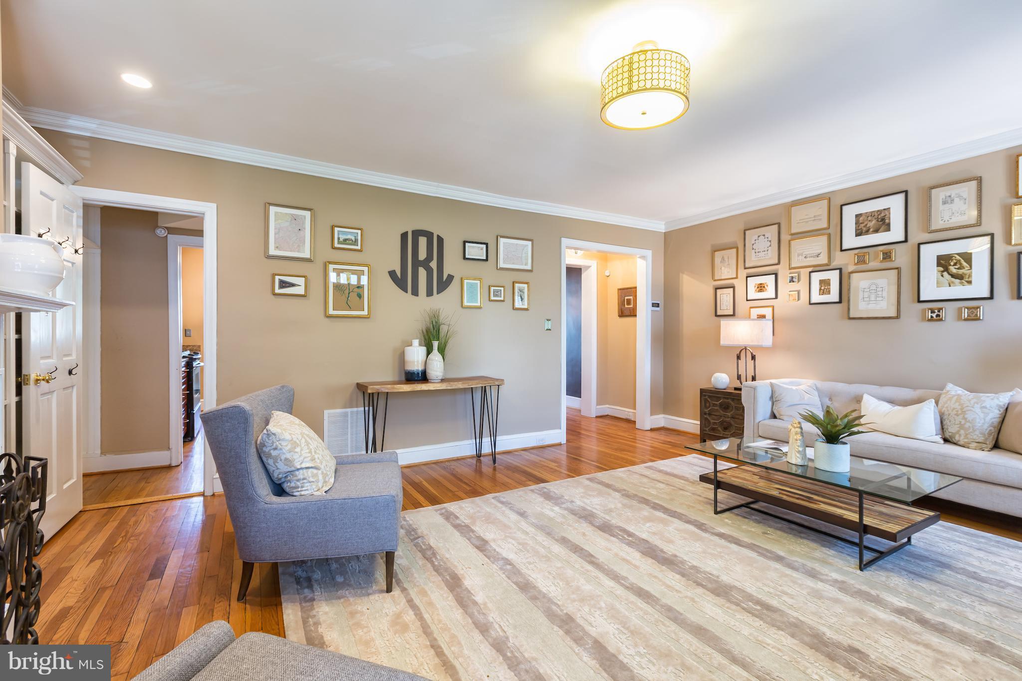 3535 R Street Northwest Washington, DC 20007 - Photo 2 of 29 a living room with furniture a rug and a window