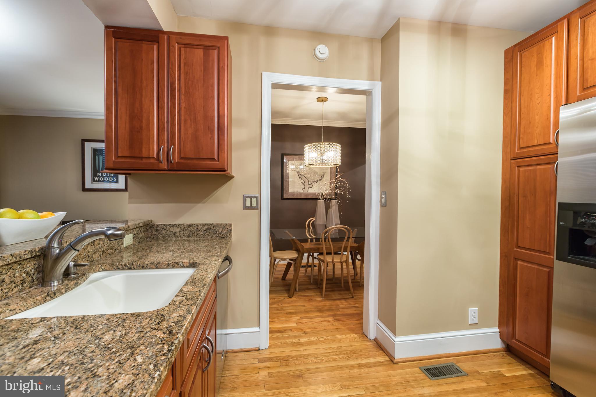 3535 R Street Northwest Washington, DC 20007 - Photo 12 of 29 a kitchen with granite countertop a sink and a refrigerator