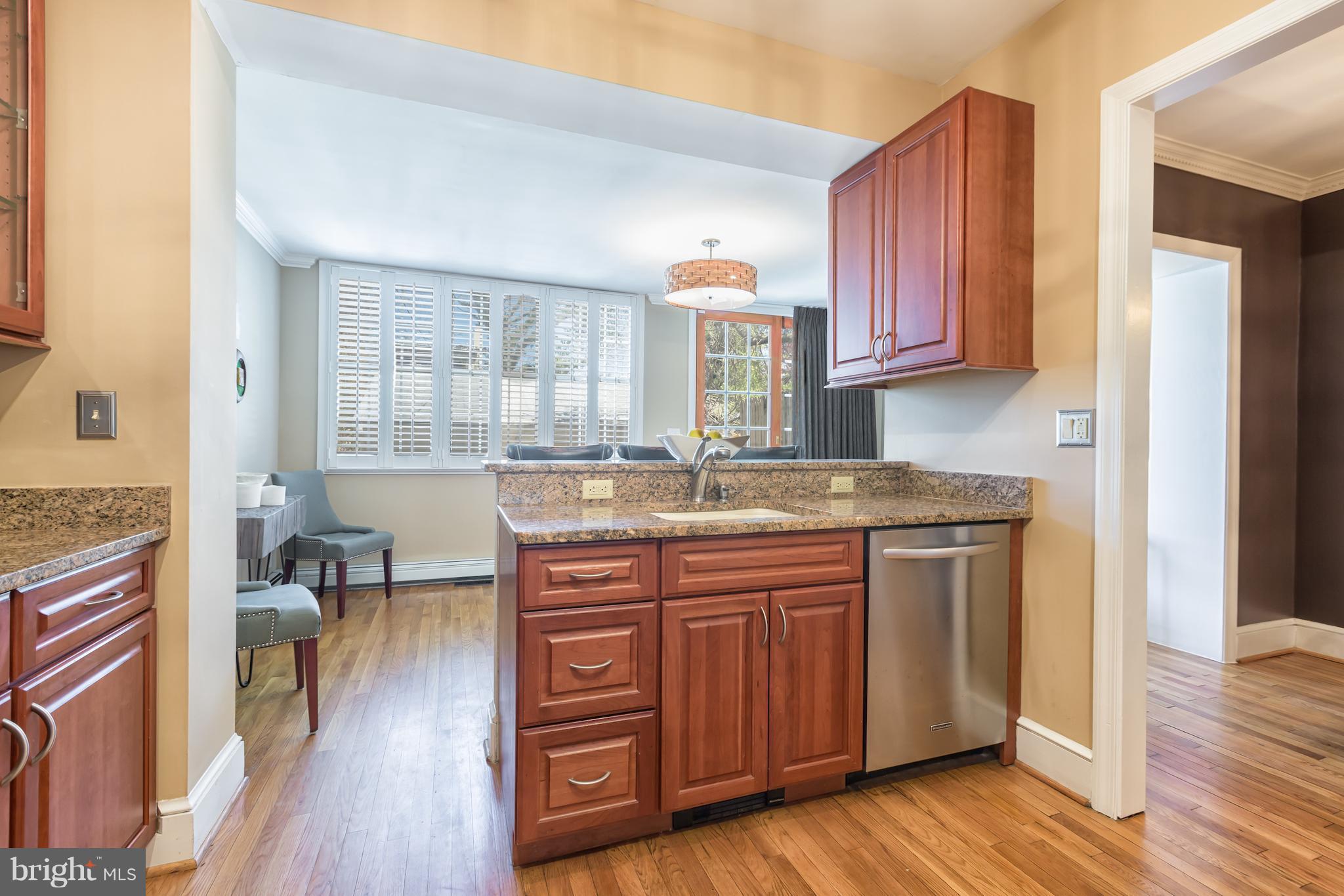 3535 R Street Northwest Washington, DC 20007 - Photo 13 of 29 a kitchen with a sink cabinets and wooden floor