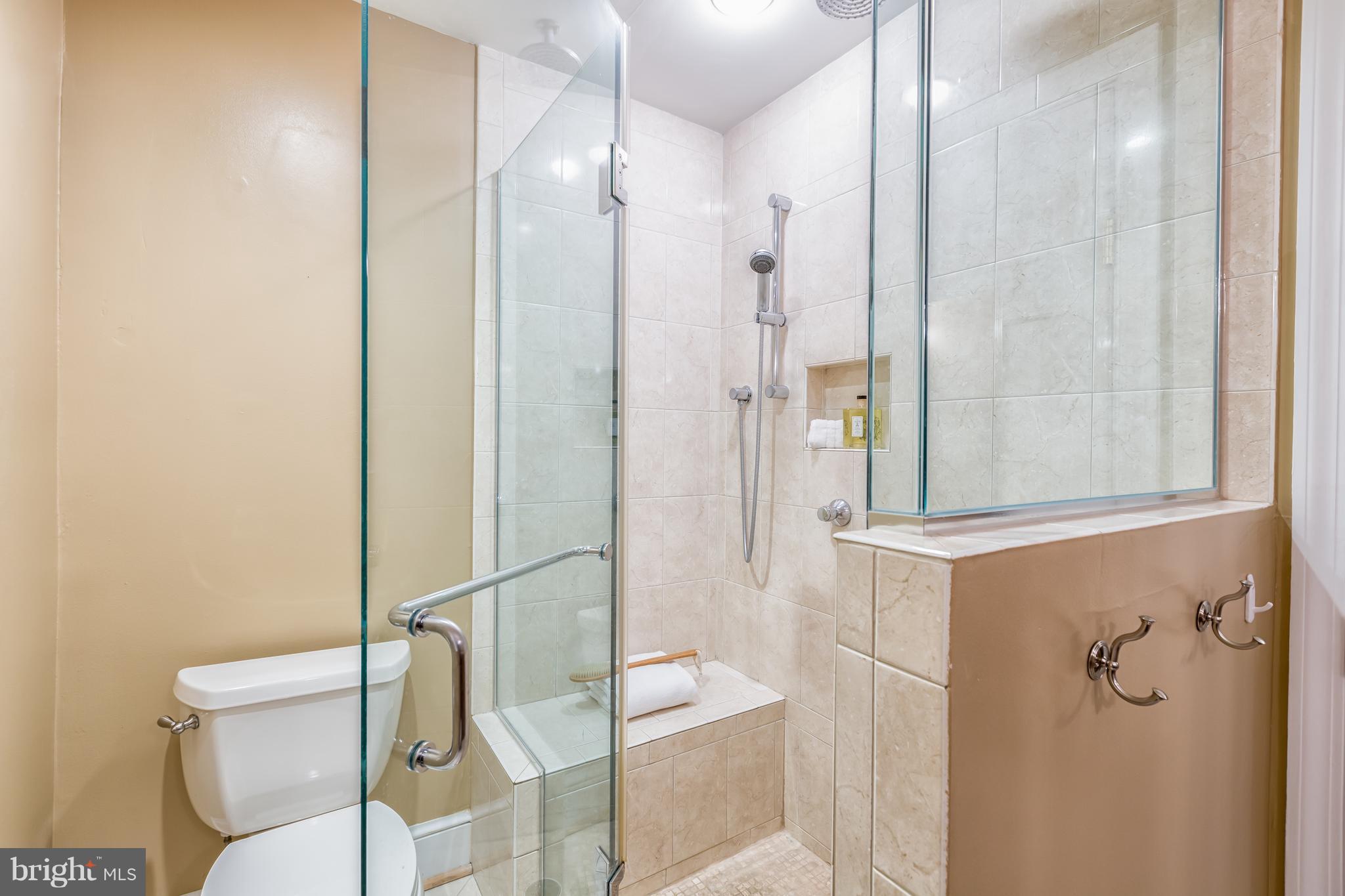 3535 R Street Northwest Washington, DC 20007 - Photo 18 of 29 a bathroom with a shower and toilet