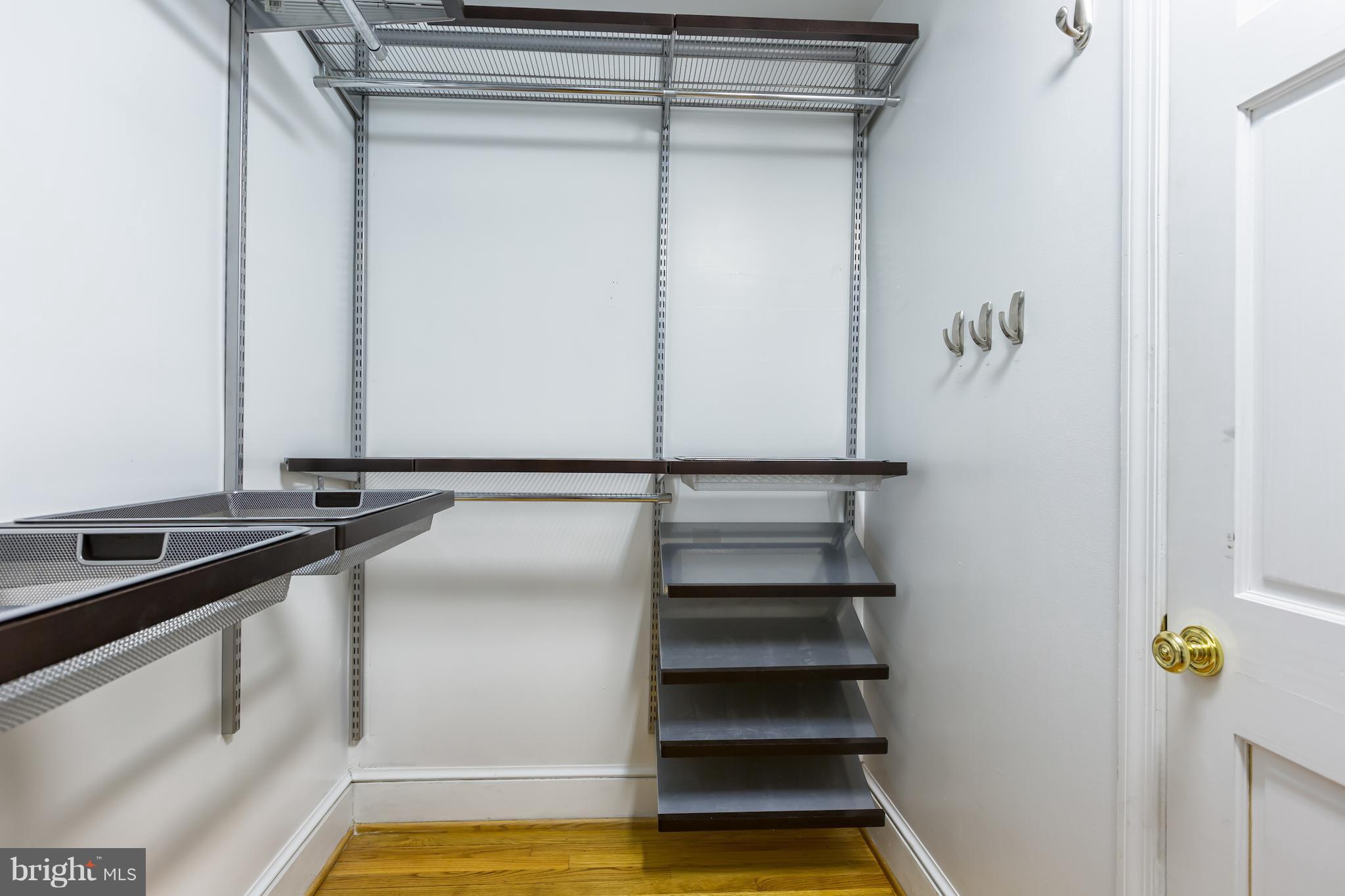 3535 R Street Northwest Washington, DC 20007 - Photo 19 of 29 a view of walk in closet with empty racks