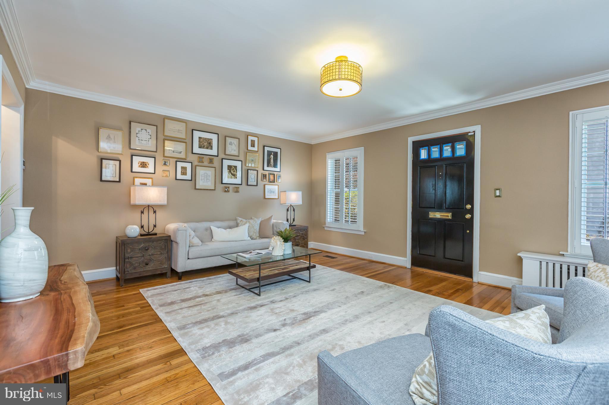 3535 R Street Northwest Washington, DC 20007 - Photo 3 of 29 a living room with furniture and painting on the wall