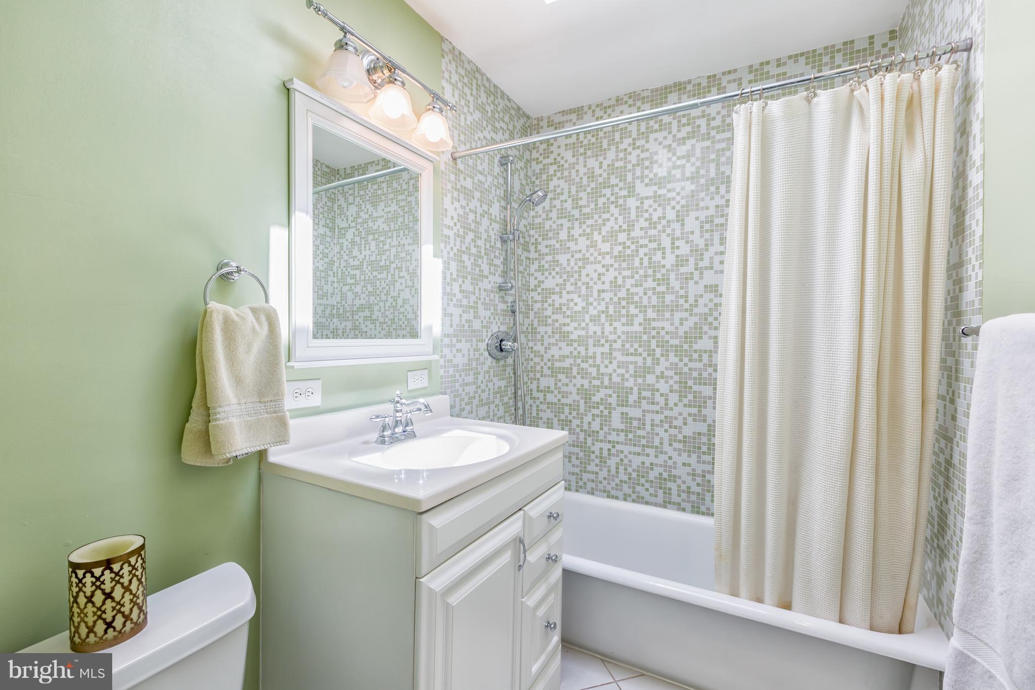 3535 R Street Northwest Washington, DC 20007 - Photo 21 of 29 a bathroom with a sink and a mirror