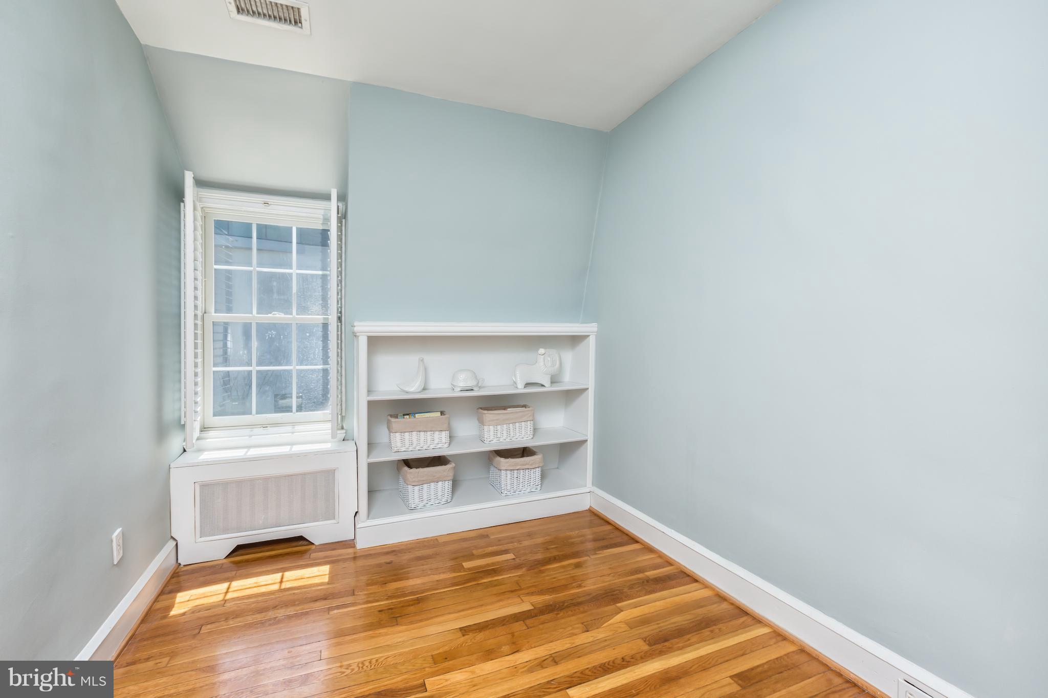 3535 R Street Northwest Washington, DC 20007 - Photo 23 of 29 a view of a room with wooden floor and a window
