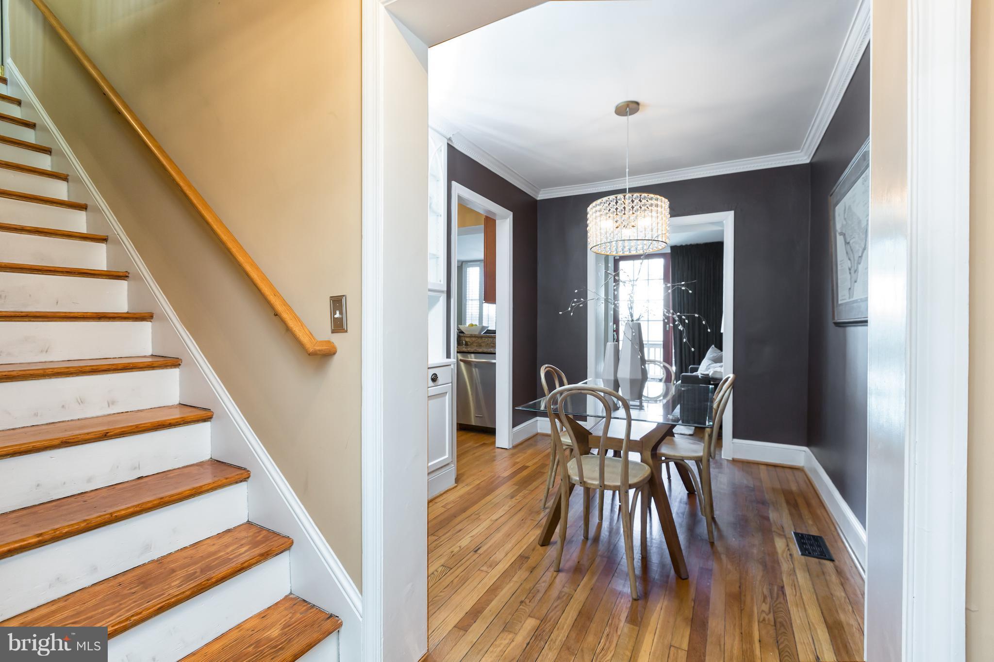 3535 R Street Northwest Washington, DC 20007 - Photo 5 of 29 a view of a hallway with wooden floor and furniture
