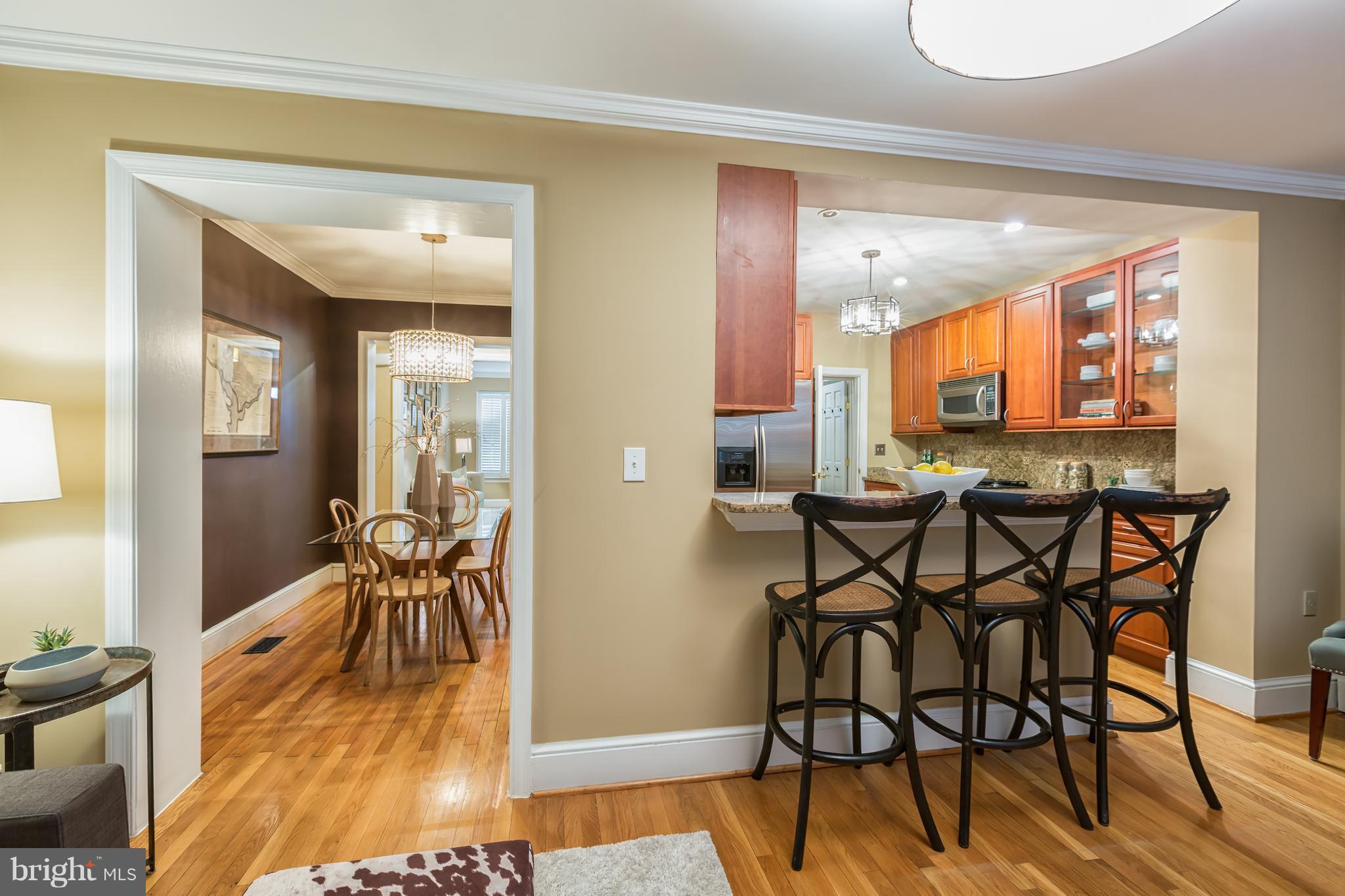 3535 R Street Northwest Washington, DC 20007 - Photo 8 of 29 a view of a dining room with furniture and wooden floor