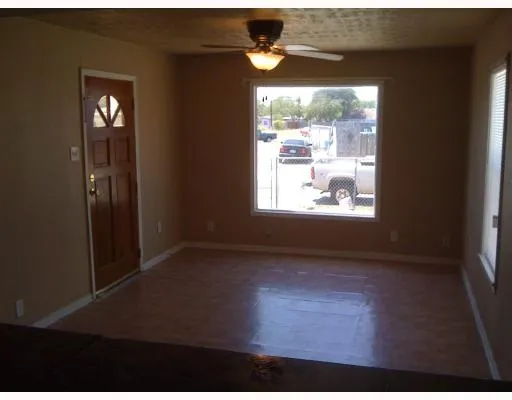 a view of an empty room and window