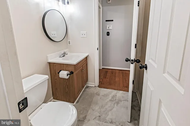 a bathroom with a sink a mirror and a shower