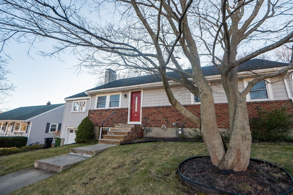 3 Pershing Road Salem, MA 01970 - Photo 2 of 38 a front view of a house with garden