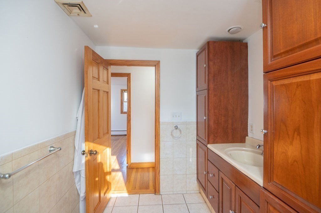 3 Pershing Road Salem, MA 01970 - Photo 27 of 38 a bathroom with a tub and shower