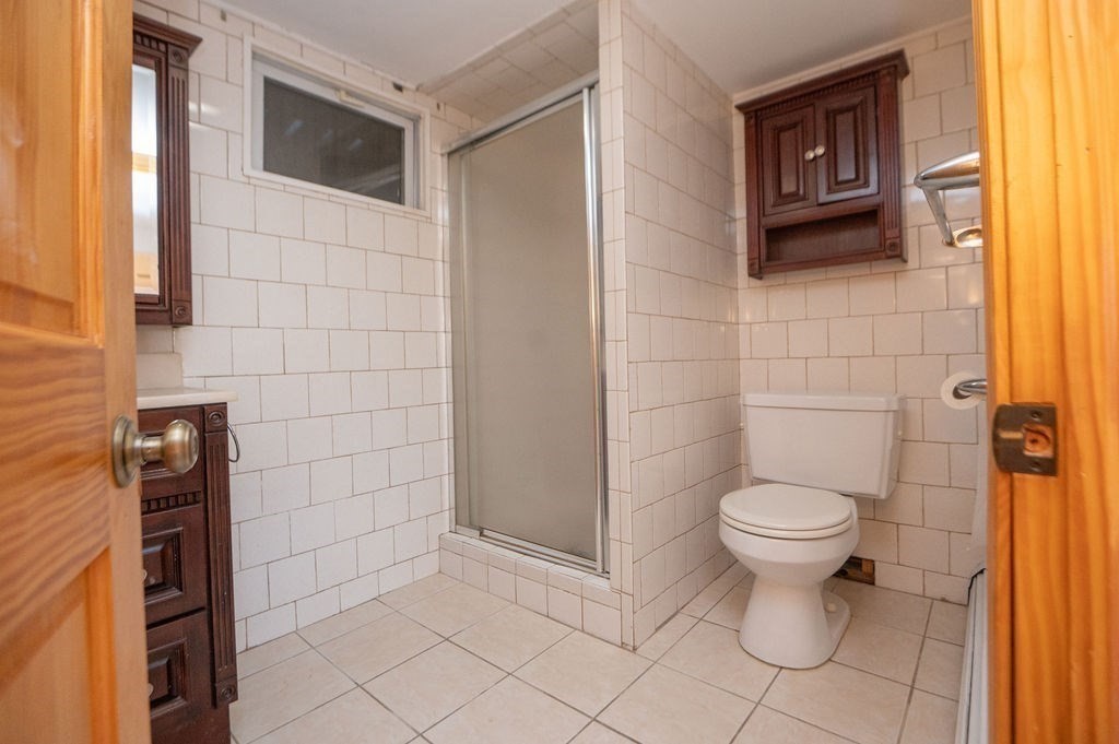 3 Pershing Road Salem, MA 01970 - Photo 31 of 38 a bathroom with a toilet sink and shower