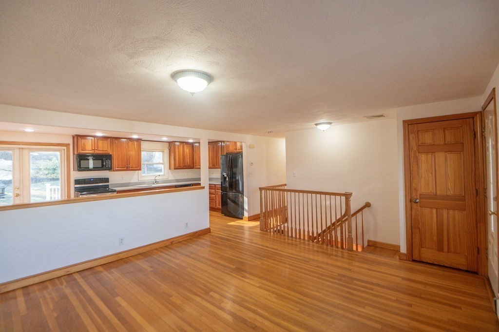 3 Pershing Road Salem, MA 01970 - Photo 8 of 38 a view of a room with wooden floor and staircase