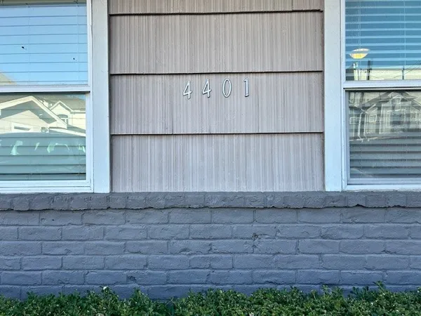 a view of a wooden fence and a window