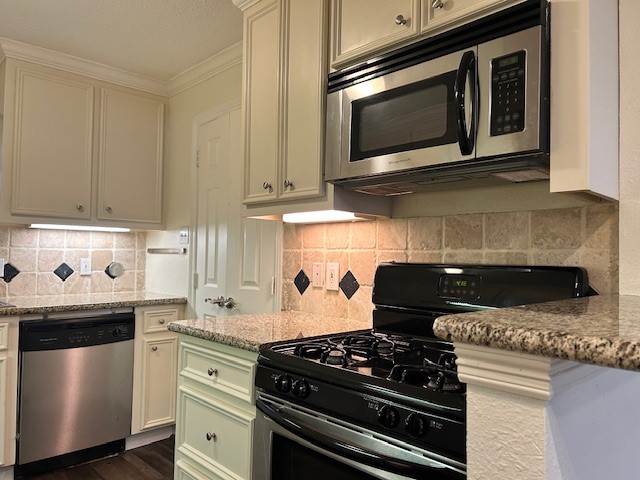 4401 Marina Street, Unit B Houston, TX 77007 - Photo 6 of 26 a kitchen with a stove and a microwave