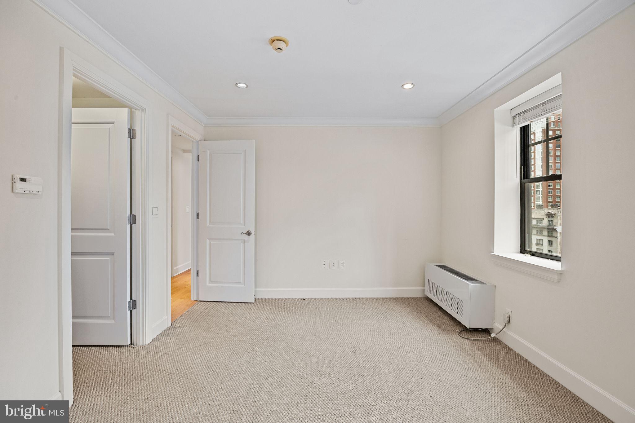 1701 Locust Street, Unit 1602 Philadelphia, PA 19103 - Photo 13 of 28 a view of an empty room with a window