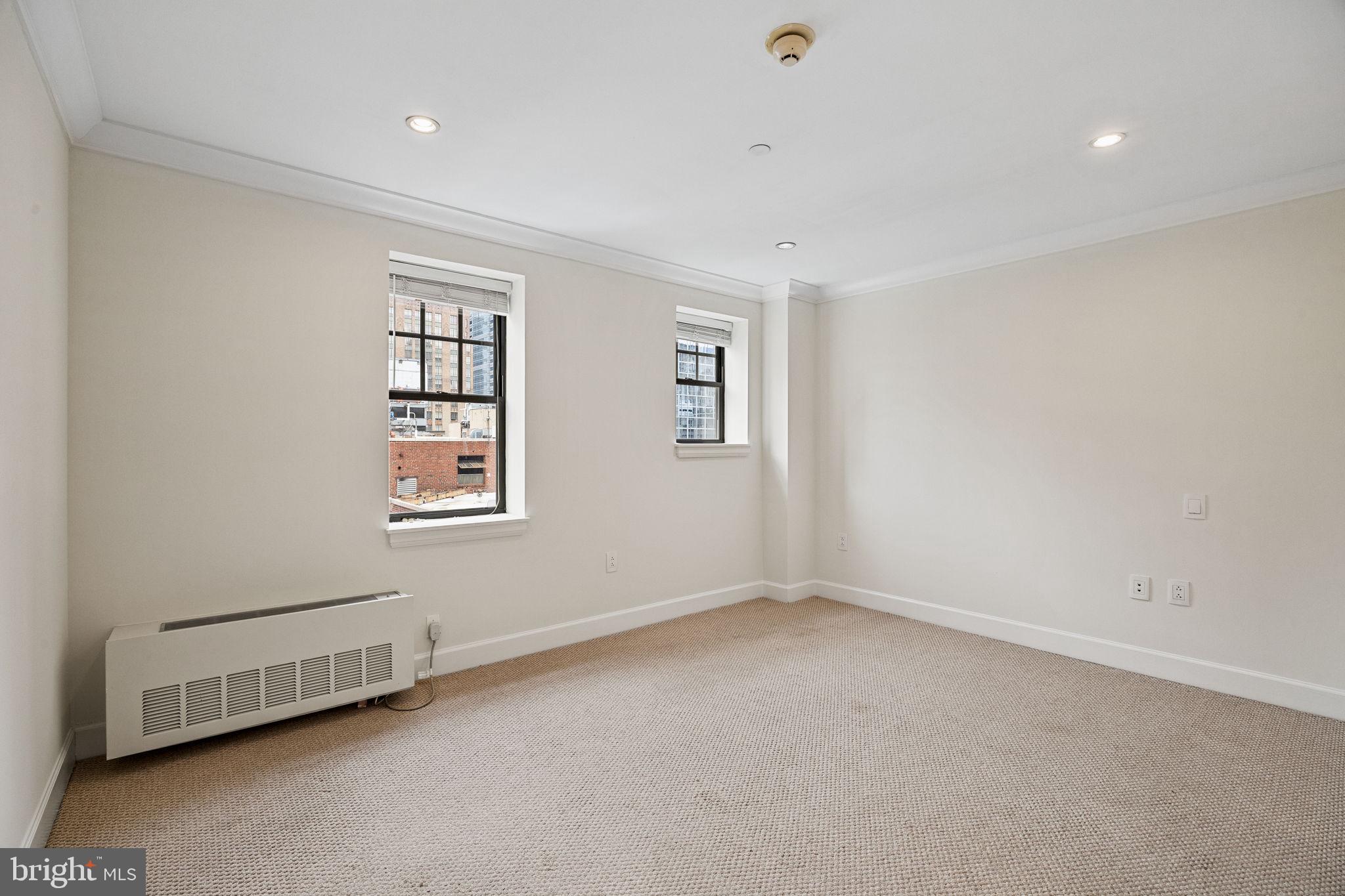 1701 Locust Street, Unit 1602 Philadelphia, PA 19103 - Photo 20 of 28 an empty room with a window