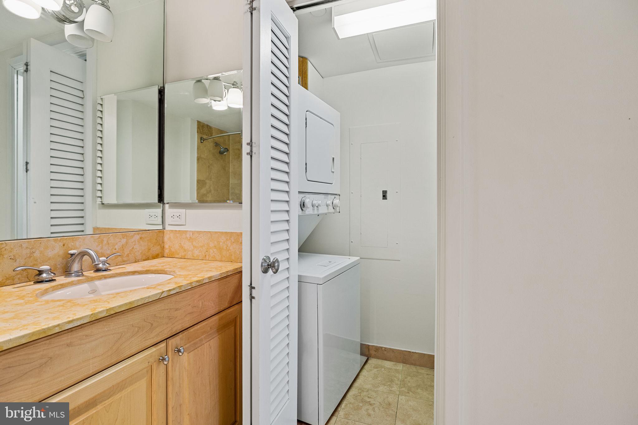 1701 Locust Street, Unit 1602 Philadelphia, PA 19103 - Photo 21 of 28 a bathroom with a sink and a mirror