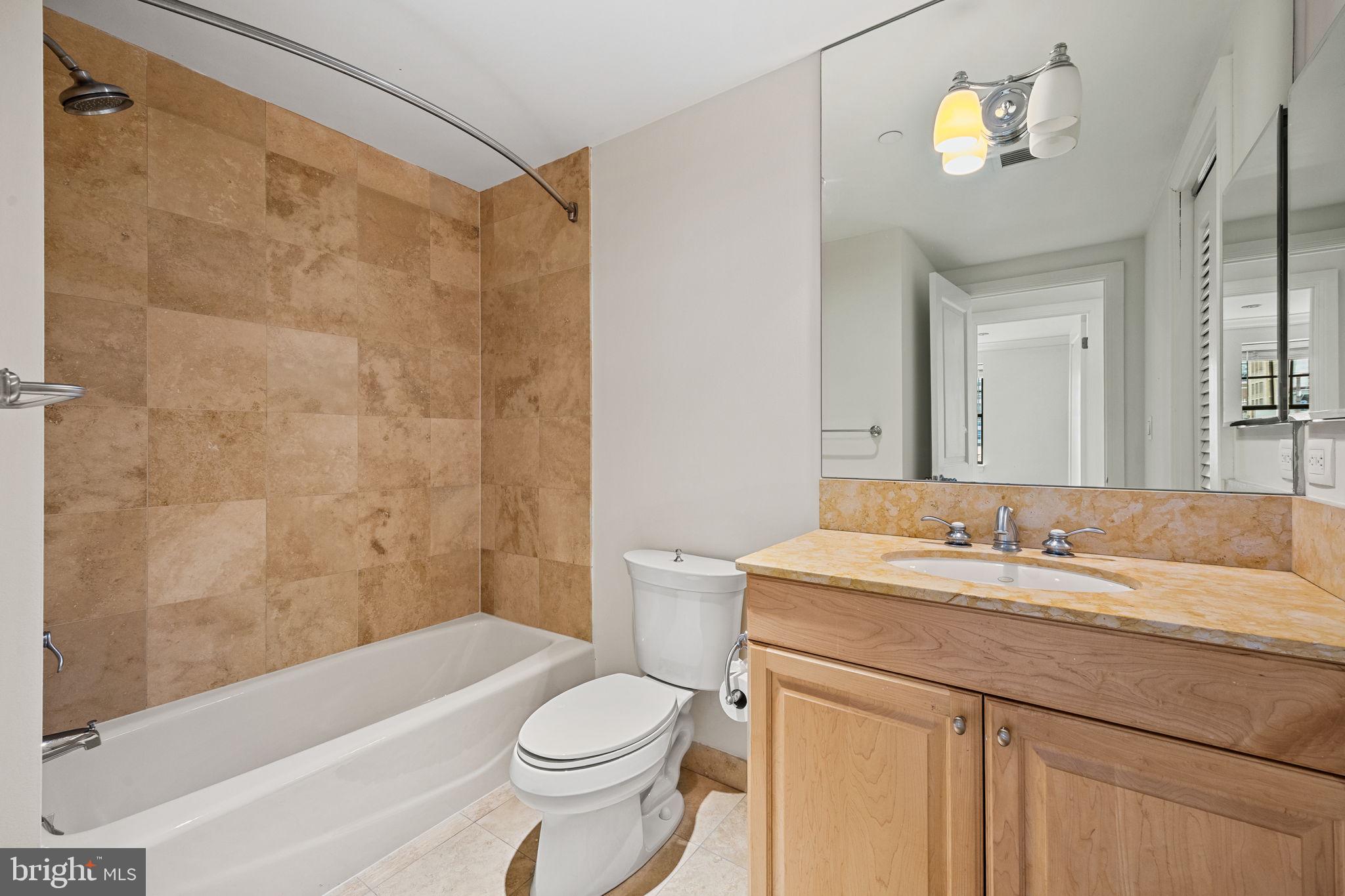1701 Locust Street, Unit 1602 Philadelphia, PA 19103 - Photo 22 of 28 a bathroom with a sink a toilet and a bathtub