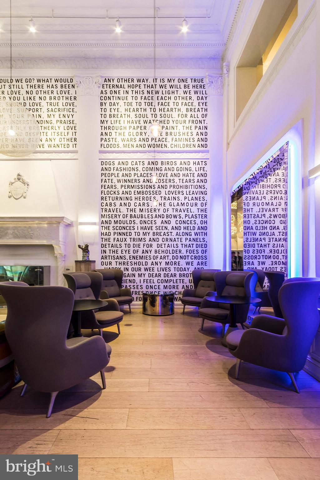 1701 Locust Street, Unit 1602 Philadelphia, PA 19103 - Photo 26 of 28 a living room with furniture windows and a fireplace