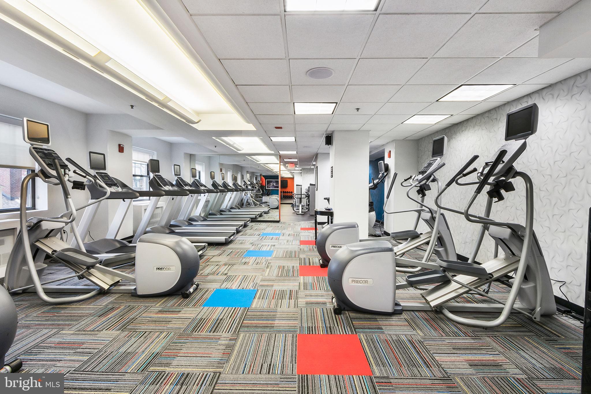 1701 Locust Street, Unit 1602 Philadelphia, PA 19103 - Photo 27 of 28 a room with gym equipment and wooden floor