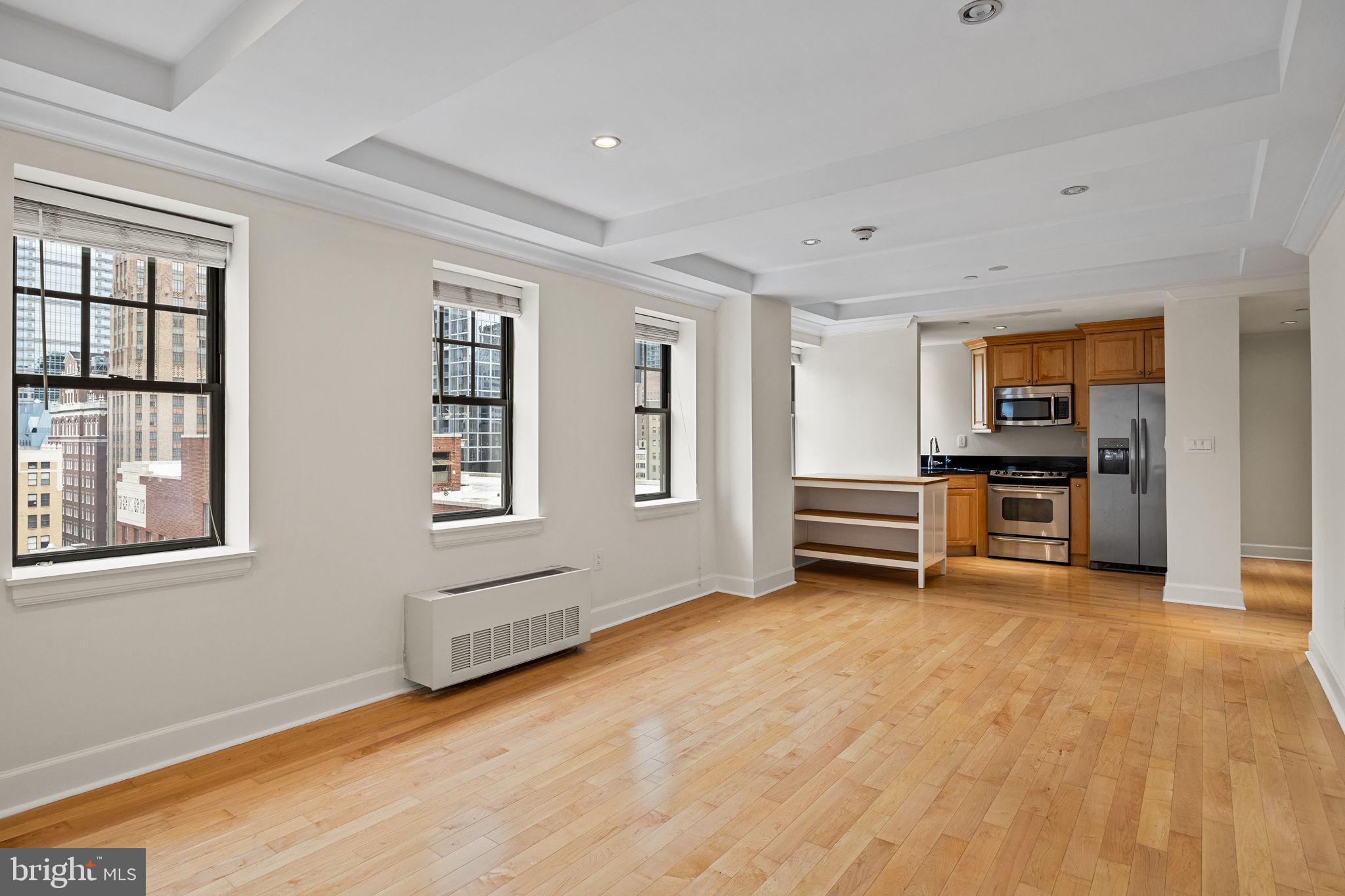 1701 Locust Street, Unit 1602 Philadelphia, PA 19103 - Photo 3 of 28 a view of an empty room with a kitchen