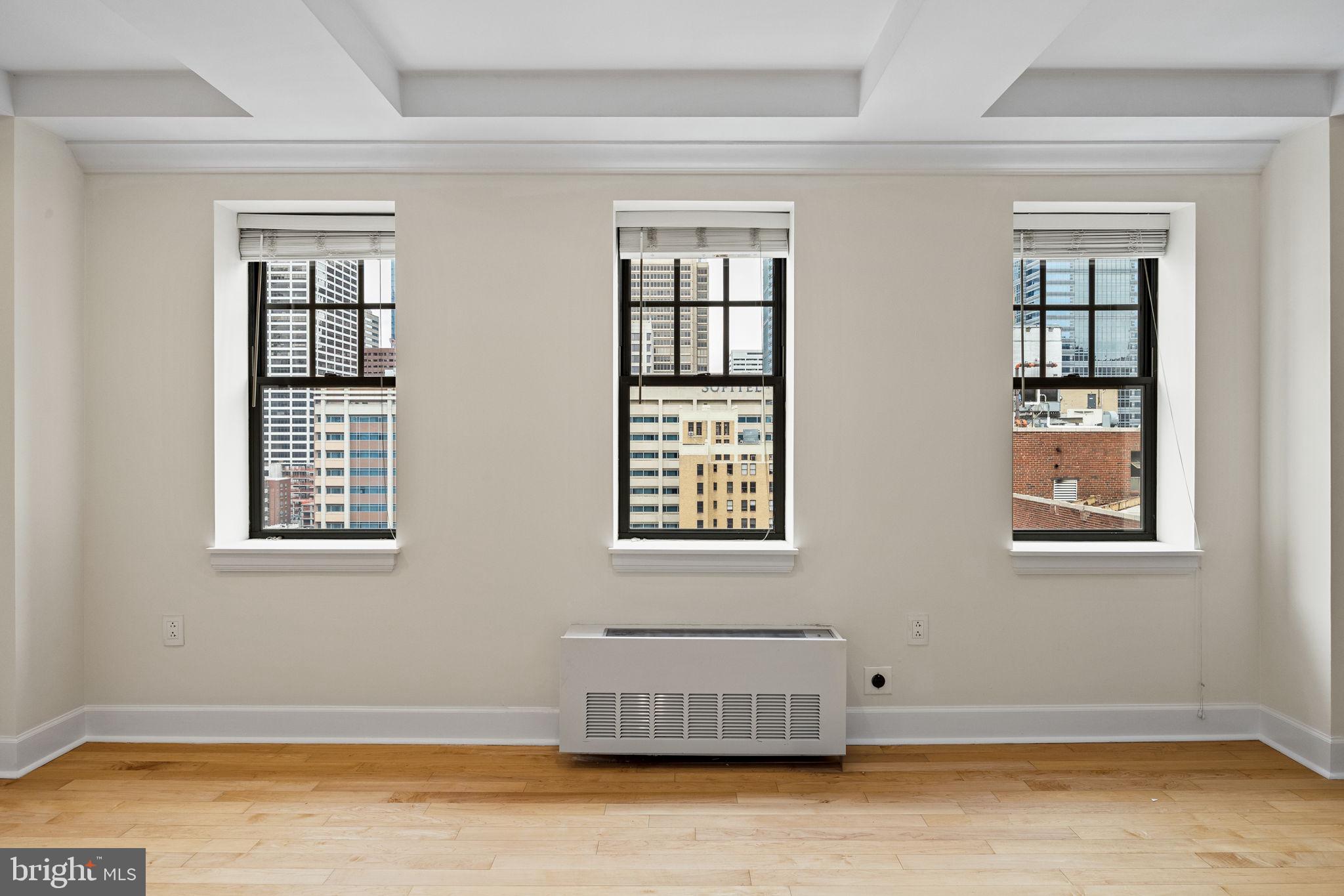 1701 Locust Street, Unit 1602 Philadelphia, PA 19103 - Photo 4 of 28 a view of an empty room with a window