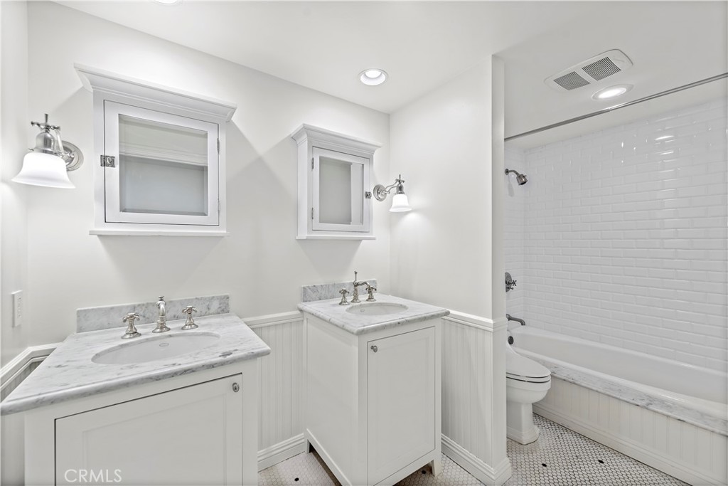 707 Emerald Bay Laguna Beach, CA 92651 - Photo 42 of 50 a bathroom with a granite countertop sink toilet and shower