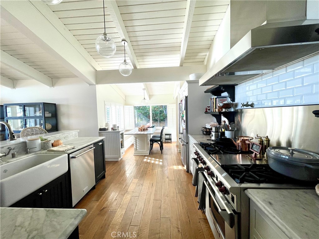 707 Emerald Bay Laguna Beach, CA 92651 - Photo 45 of 50 a kitchen with stove and wooden floor