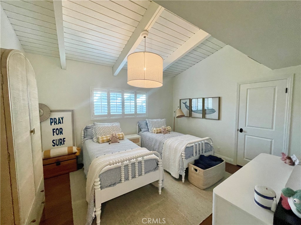 707 Emerald Bay Laguna Beach, CA 92651 - Photo 47 of 50 a bedroom with two beds and a window