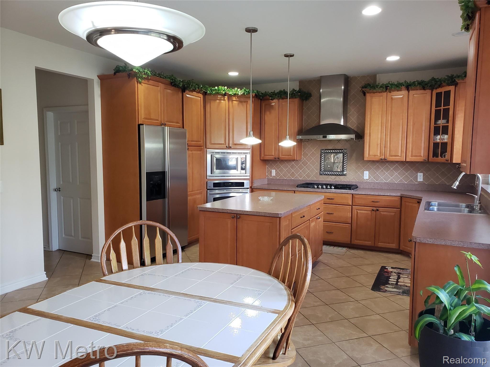 1227 Letica Drive Rochester, MI 48307 - Photo 24 of 58 Kitchen with Convection Oven and Microwave
