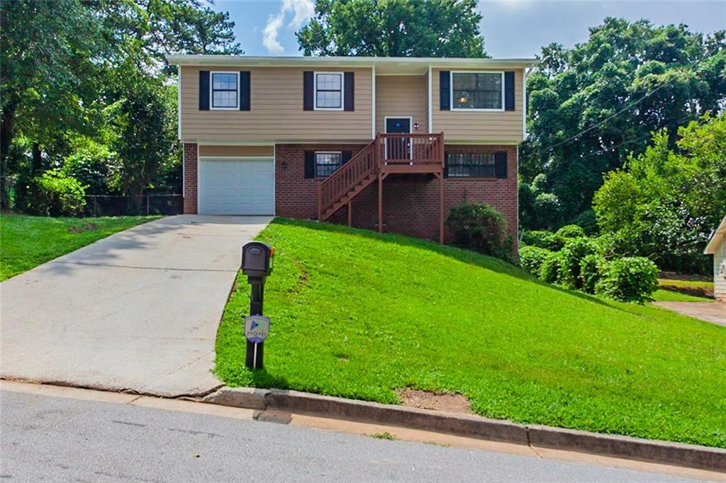 2771 Rockdale Drive Decatur, GA 30034 - Photo 1 of 1 a front view of house with yard and green space