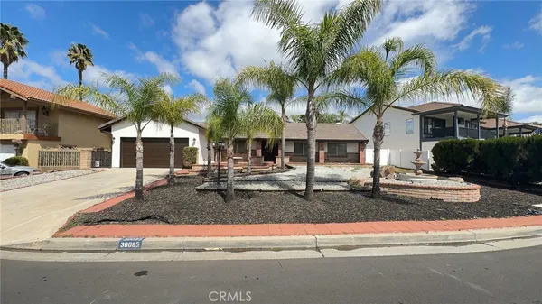 a front view of house with yard and outdoor seating