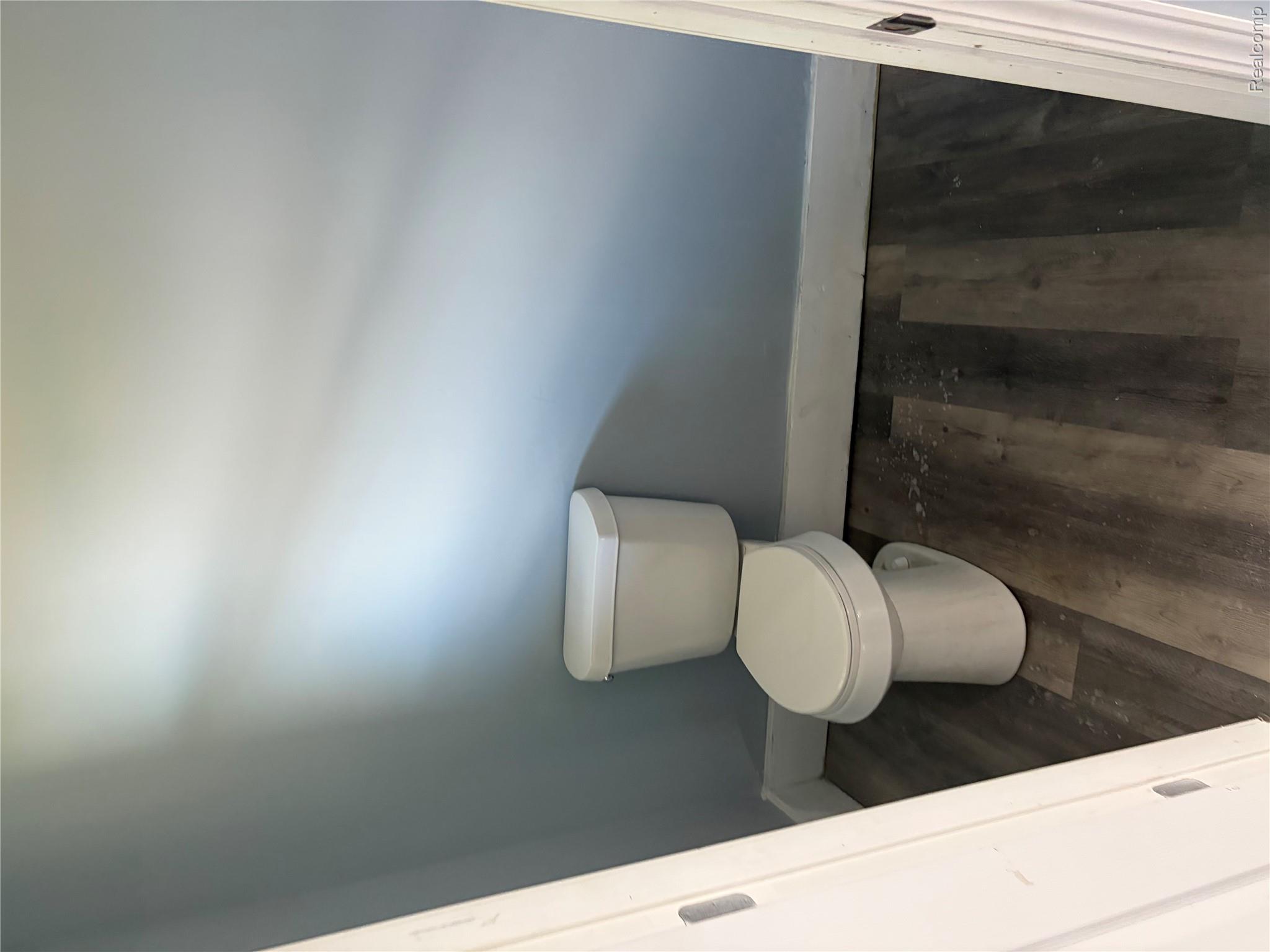 2420 Field Street Detroit, MI 48214 - Photo 9 of 15 Bathroom with toilet and dark wood-style floors