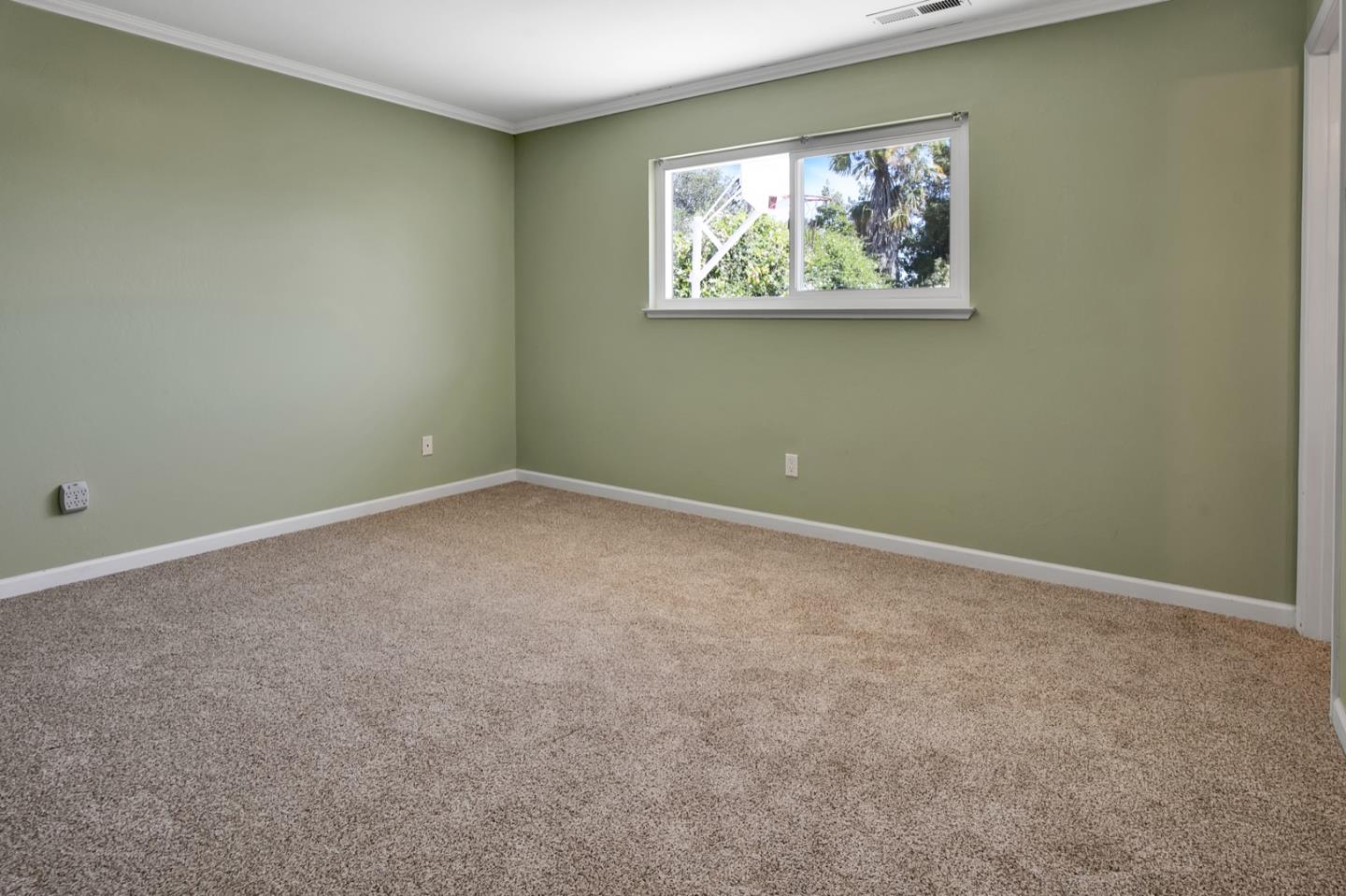 210 Hames Road Corralitos, CA 95076 - Photo 15 of 17 an empty room with a painting on the wall