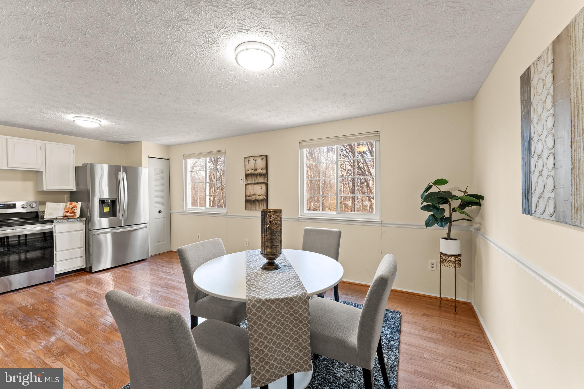 1616 Barnstead Drive Reston, VA 20194 - Photo 14 of 49 a view of a dining room with furniture and wooden floor
