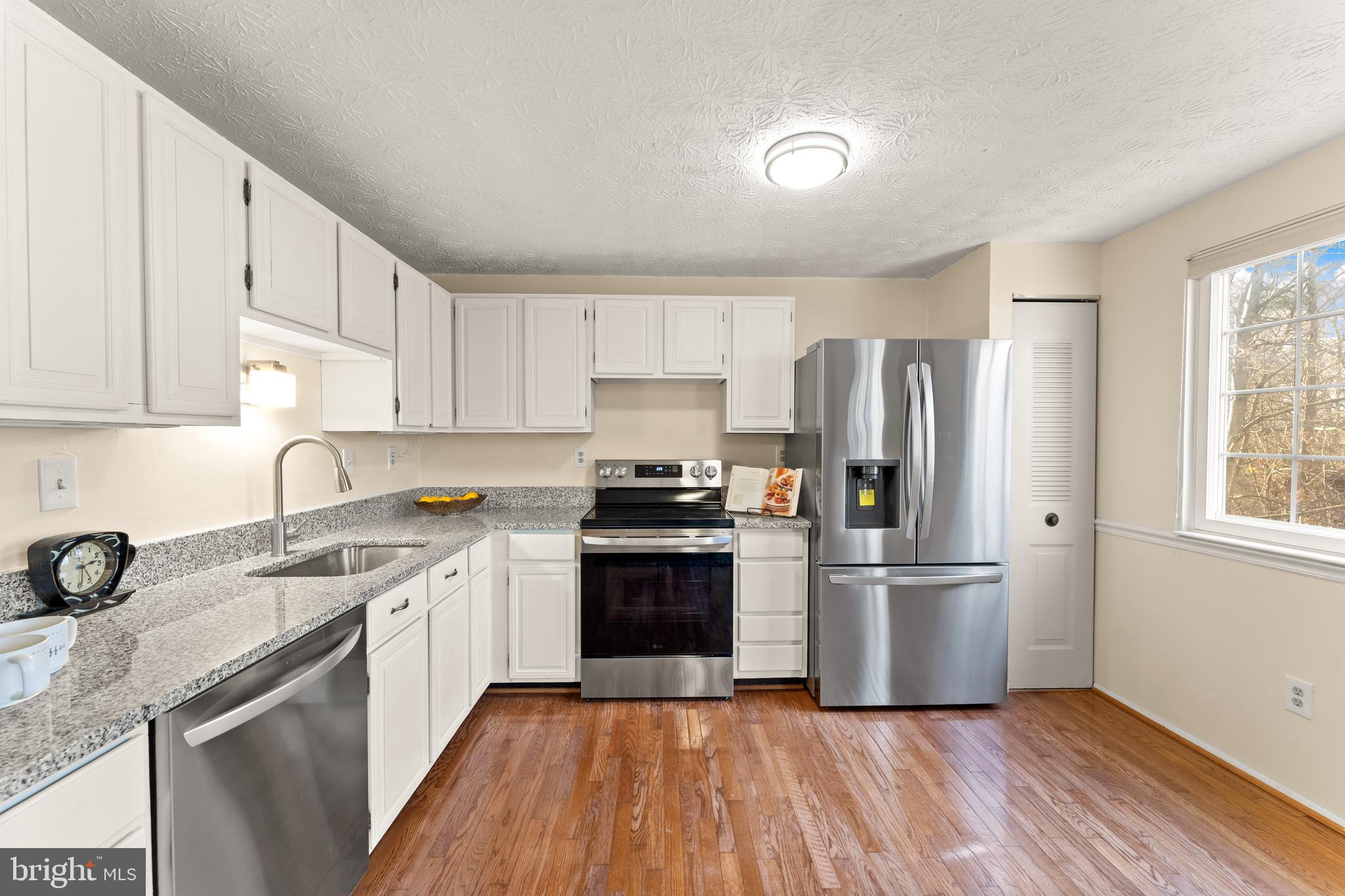 1616 Barnstead Drive Reston, VA 20194 - Photo 17 of 49 a kitchen with a refrigerator sink and cabinets