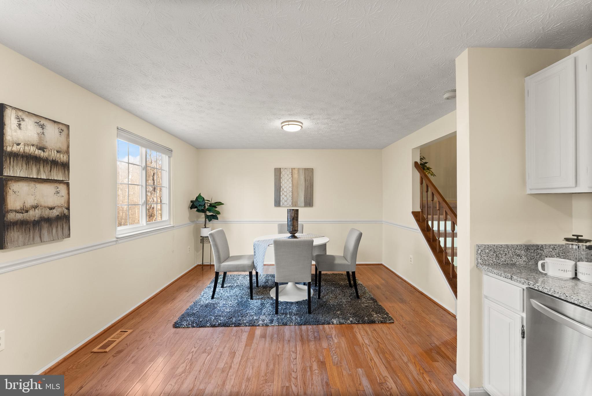 1616 Barnstead Drive Reston, VA 20194 - Photo 18 of 49 a view of a livingroom with furniture a book and wooden floor