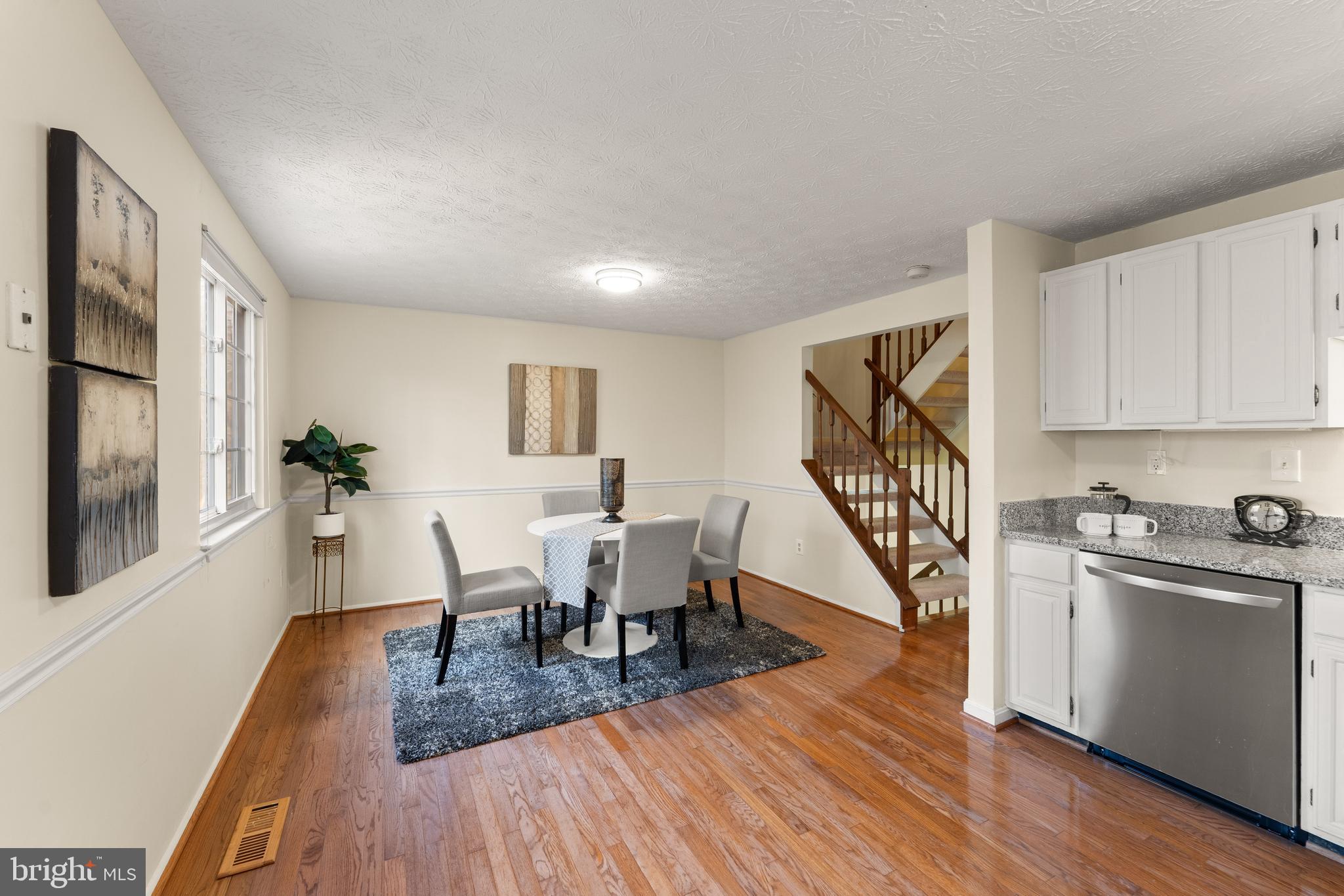 1616 Barnstead Drive Reston, VA 20194 - Photo 19 of 49 a view of a dining room with furniture and wooden floor