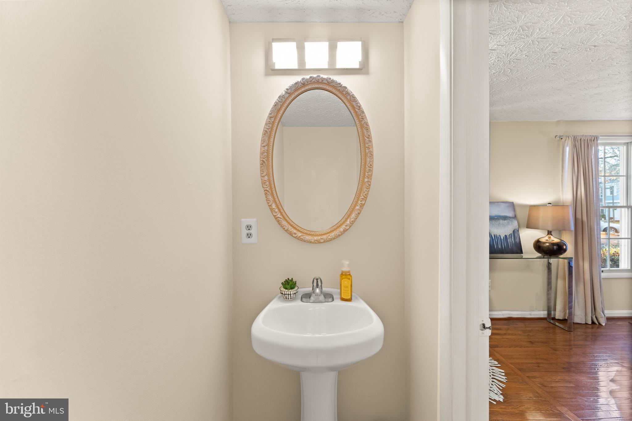 1616 Barnstead Drive Reston, VA 20194 - Photo 21 of 49 a bathroom with a sink and a mirror
