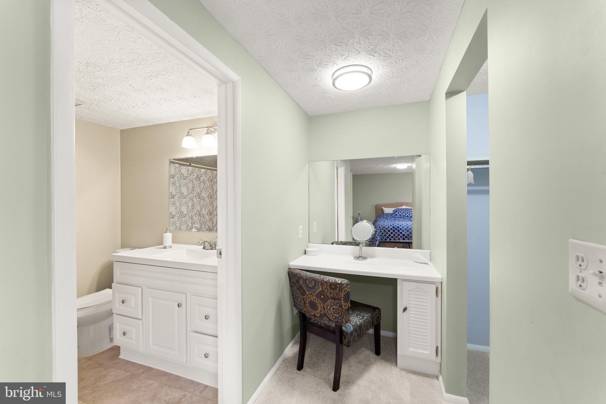 1616 Barnstead Drive Reston, VA 20194 - Photo 28 of 49 a view of a bathroom with a sink a toilet and a mirror