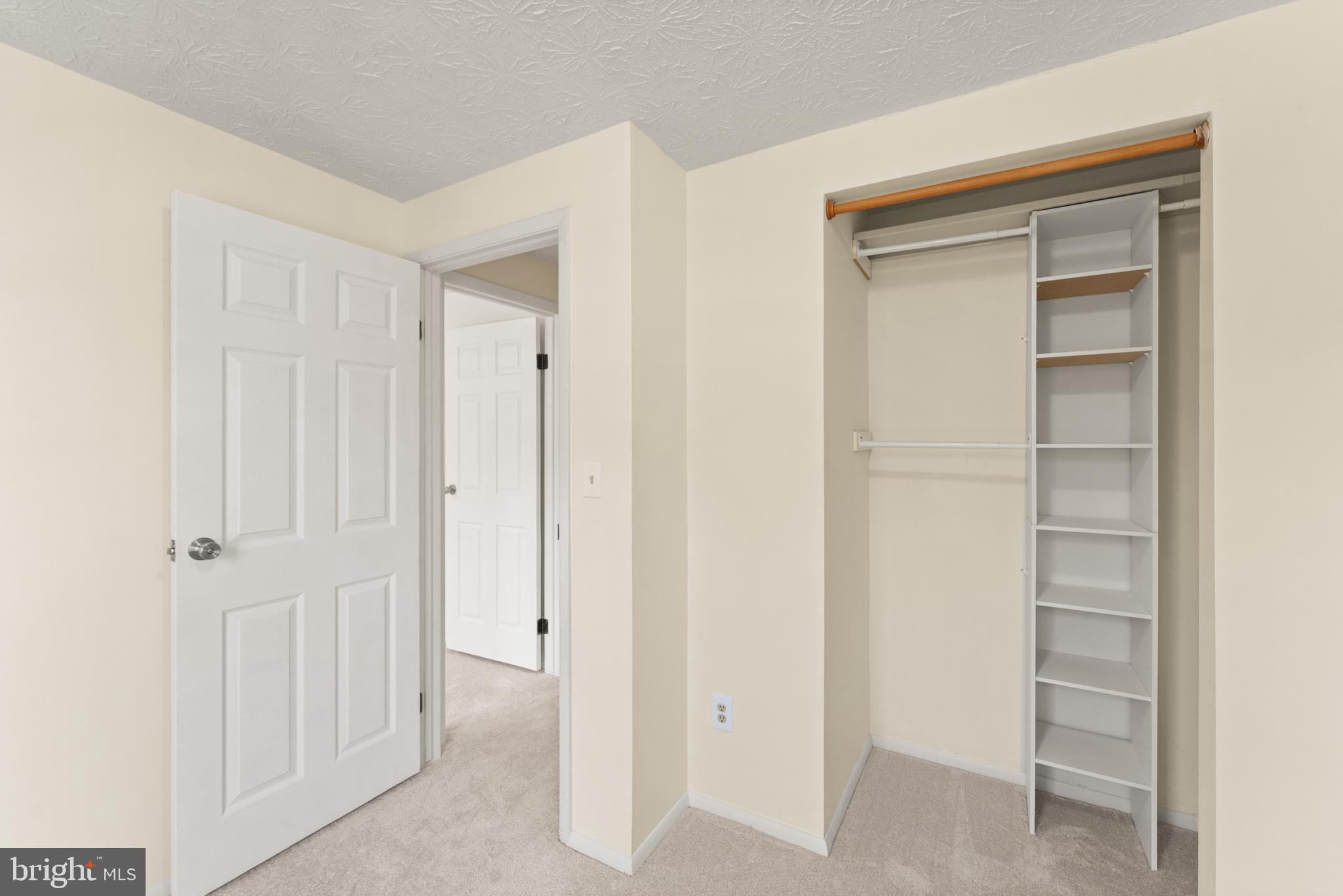 1616 Barnstead Drive Reston, VA 20194 - Photo 37 of 49 a view of walk in closet with empty racks