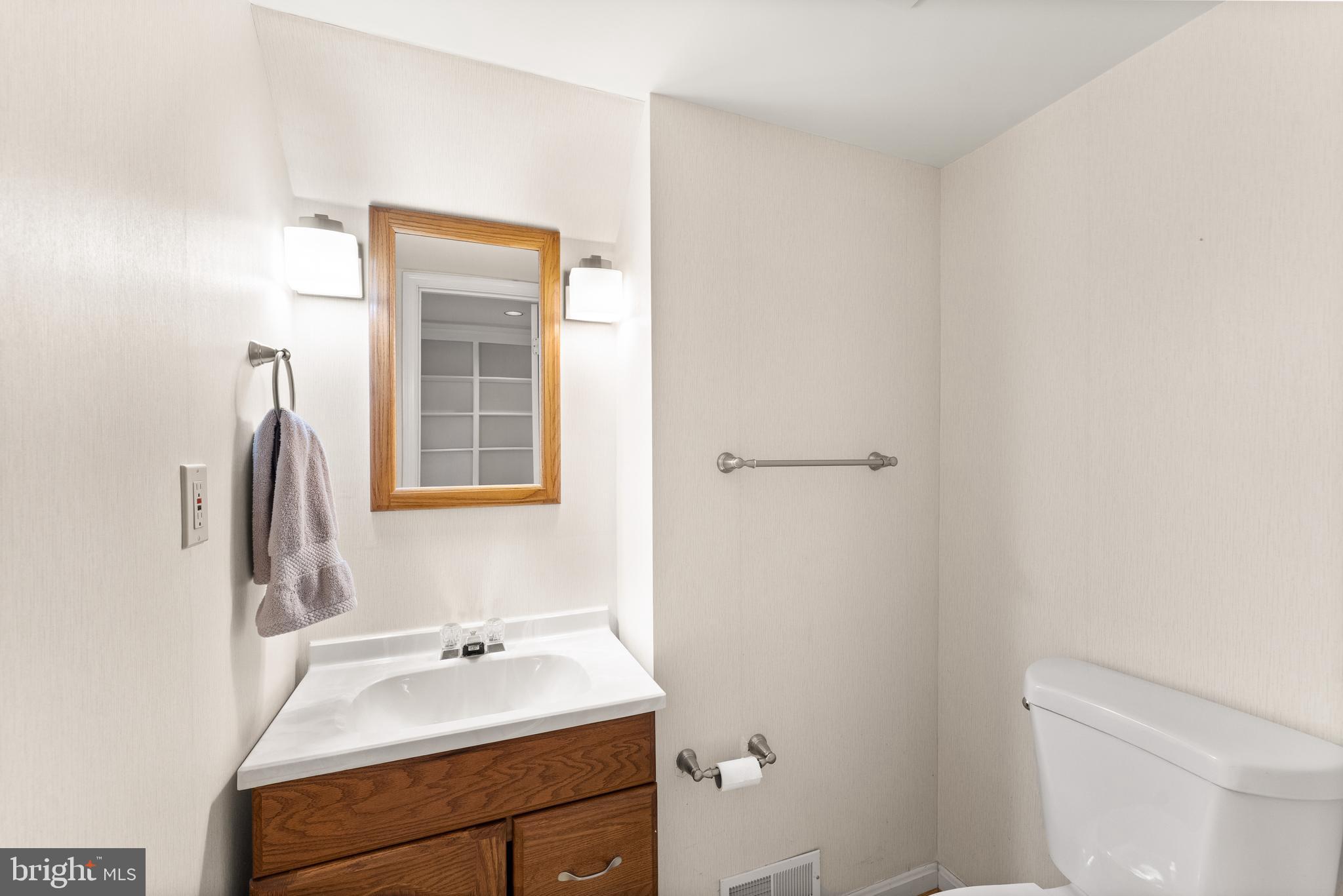 1616 Barnstead Drive Reston, VA 20194 - Photo 43 of 49 a bathroom with a sink a toilet and a mirror