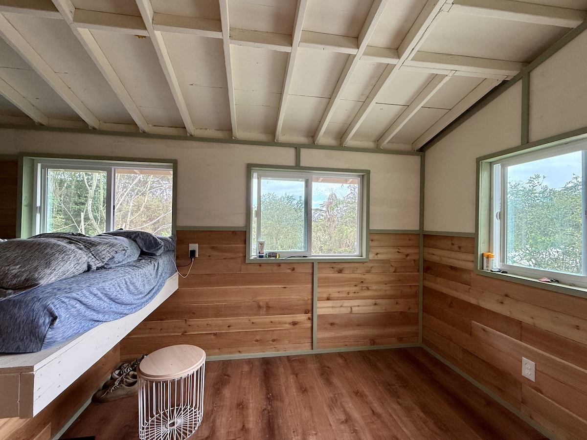 17-3853 Enos Road Mountain View, HI 96760 - Photo 12 of 20 a spacious bedroom with a bed and wooden floor