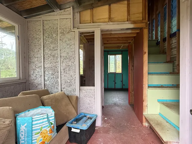 a view of a livingroom with furniture and windows