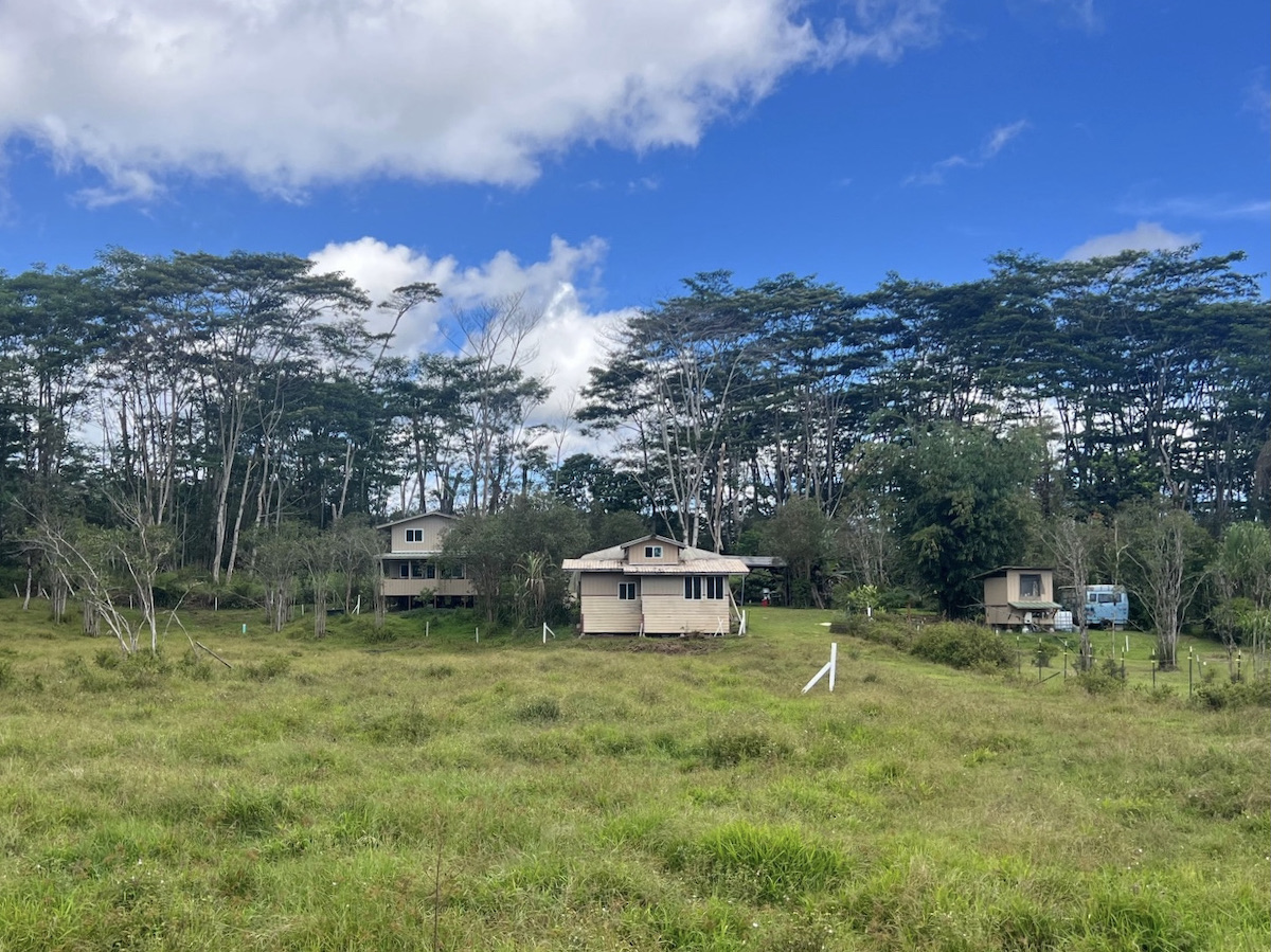 17-3853 Enos Road Mountain View, HI 96760 - Photo 2 of 20 a backyard of a house with table and chairs